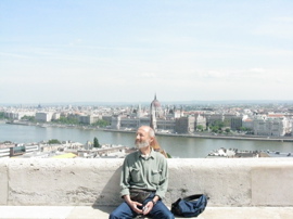 Sandor at the Hálasz-bástya, the Dandube and Pest behind him.