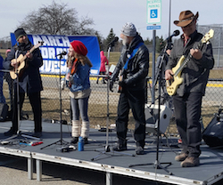 The band on stage at the rally